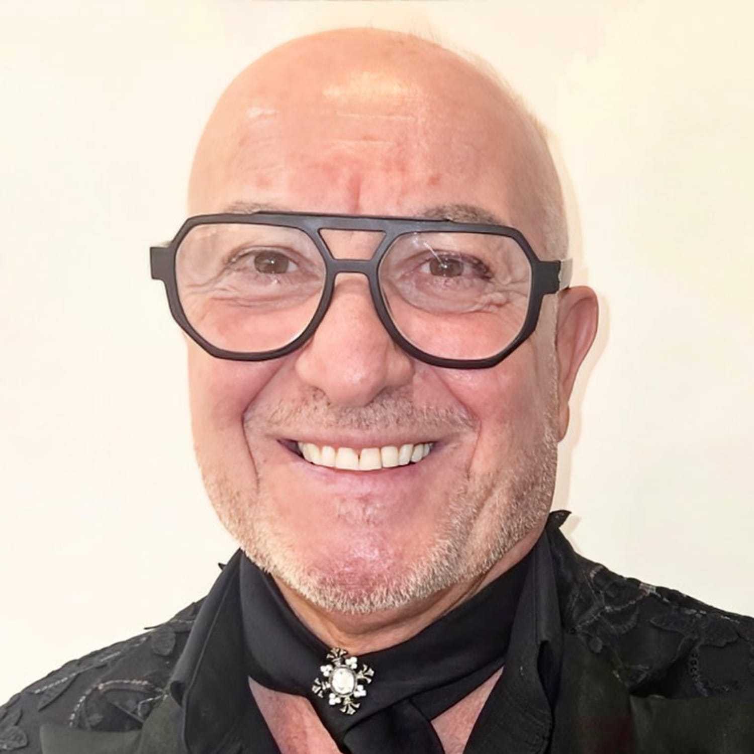 Portrait of Francesco, a professional stylist at The Greenroom Salon, showcasing their expertise and style.