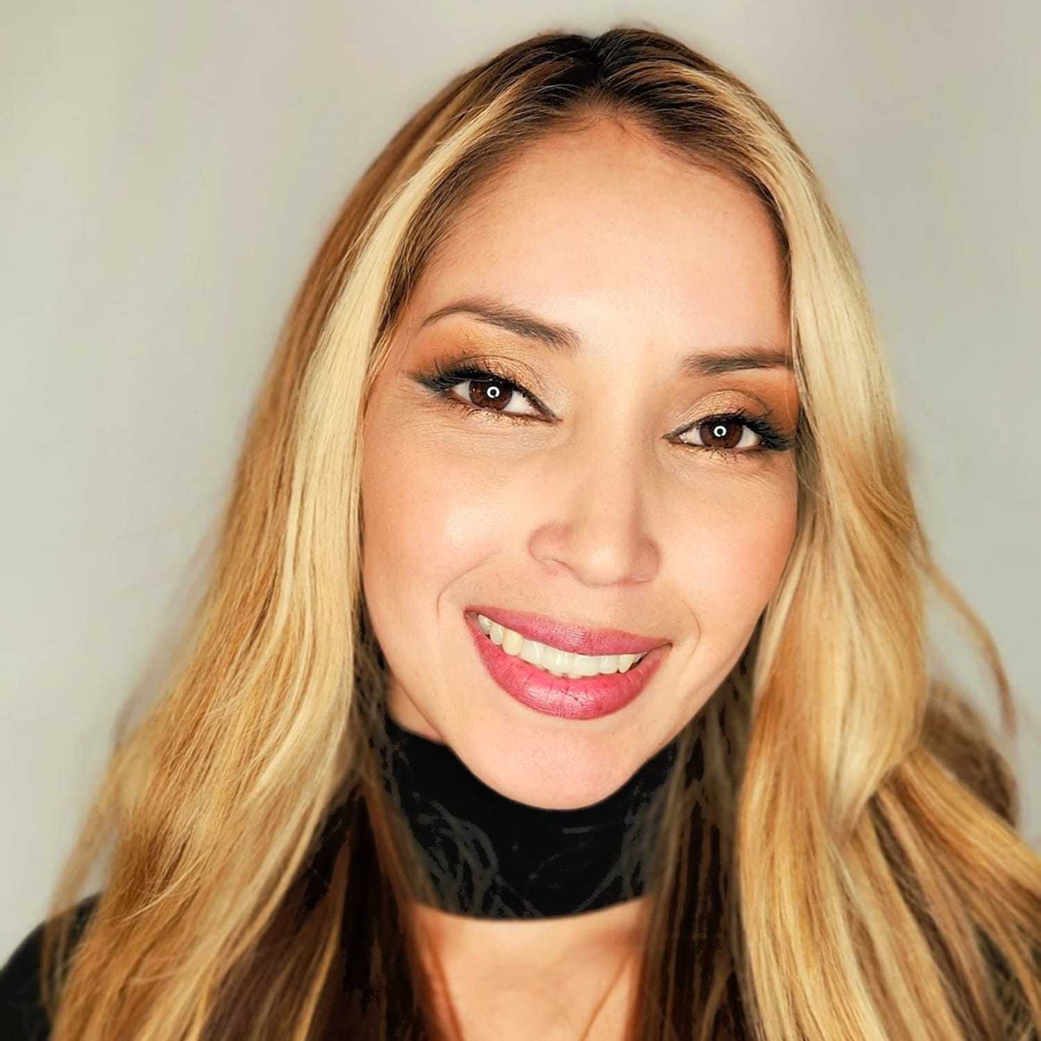 Portrait of Perla, a professional stylist at The Greenroom Salon, showcasing their expertise and style.