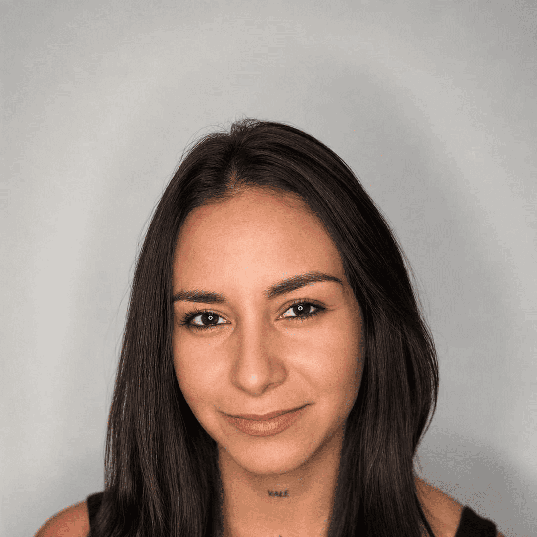 Portrait of Angie, a professional stylist at The Greenroom Salon, showcasing their expertise and style.