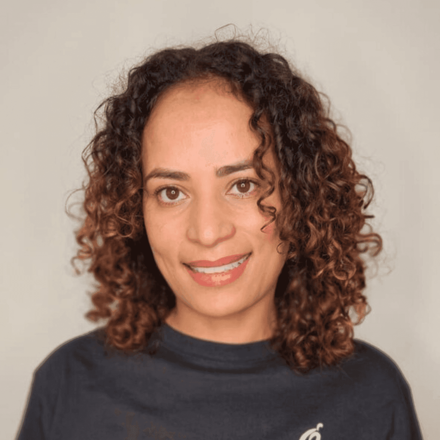 Portrait of Silva, a professional stylist at The Greenroom Salon, showcasing their expertise and style.