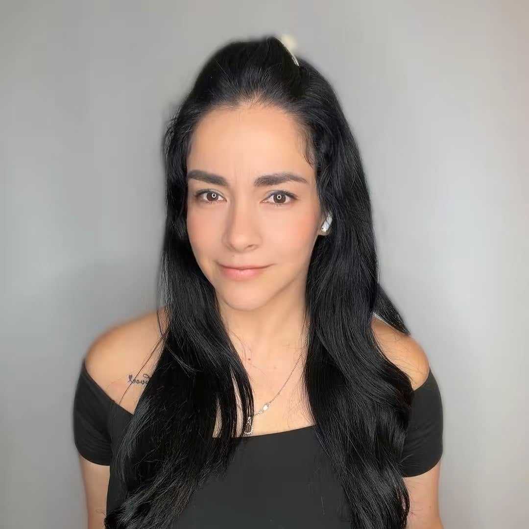 Portrait of Vanessa, a professional stylist at The Greenroom Salon, showcasing their expertise and style.