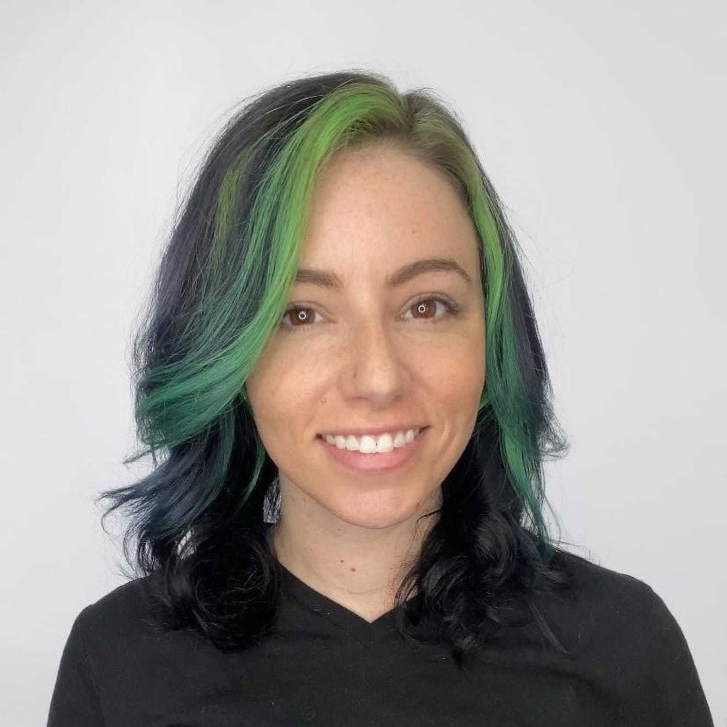 Portrait of Rachel Karlen, a professional stylist at The Greenroom Salon, showcasing their expertise and style.