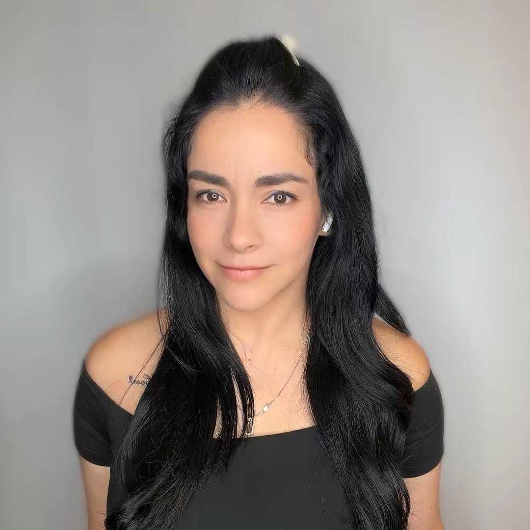 Portrait of Vanessa, a professional stylist at The Greenroom Salon, showcasing their expertise and style.